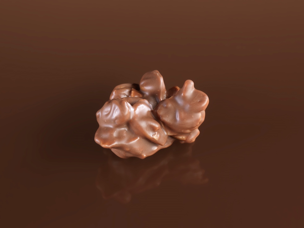 Pistacchi pinoli e mandorle caramellate ricoperte con cioccolato al latte